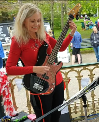 Caroline Guirr playing bass guitar